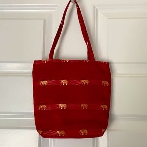 Small red bag with elephant design